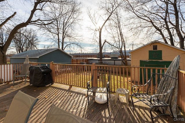 wooden deck featuring area for grilling