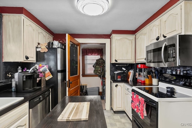 kitchen with stainless steel appliances, tasteful backsplash, and sink