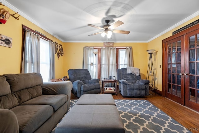 living room featuring french doors, hardwood / wood-style floors, plenty of natural light, and ornamental molding