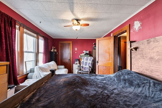 bedroom with ceiling fan and crown molding