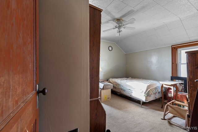 bedroom with carpet flooring, ceiling fan, and lofted ceiling