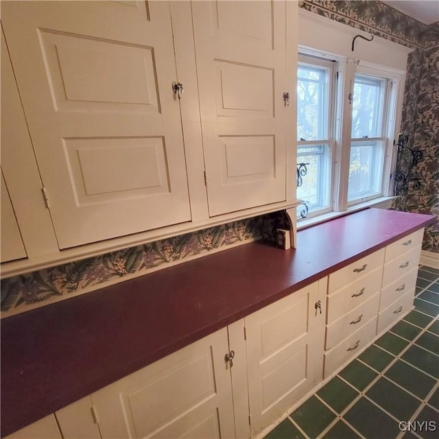 kitchen featuring white cabinets