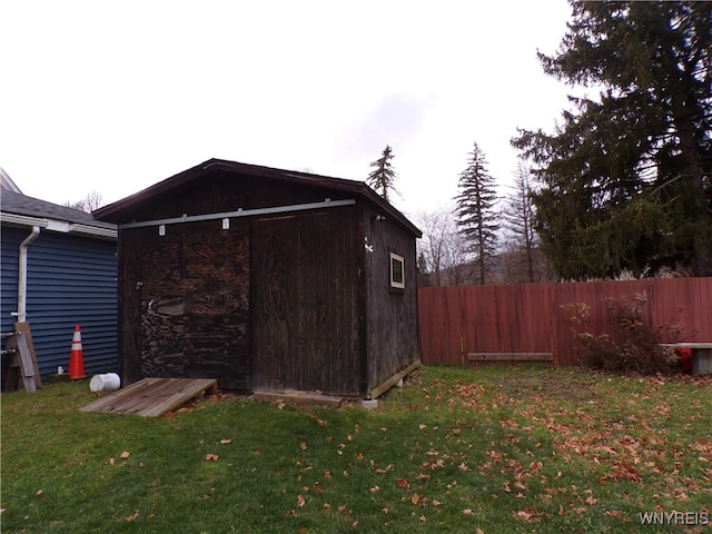 view of outbuilding with a yard