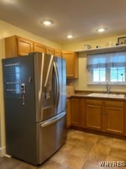 kitchen with stainless steel refrigerator and sink