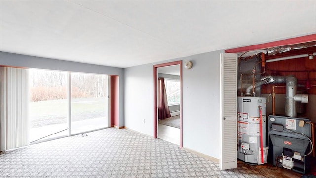 interior space featuring carpet flooring and gas water heater