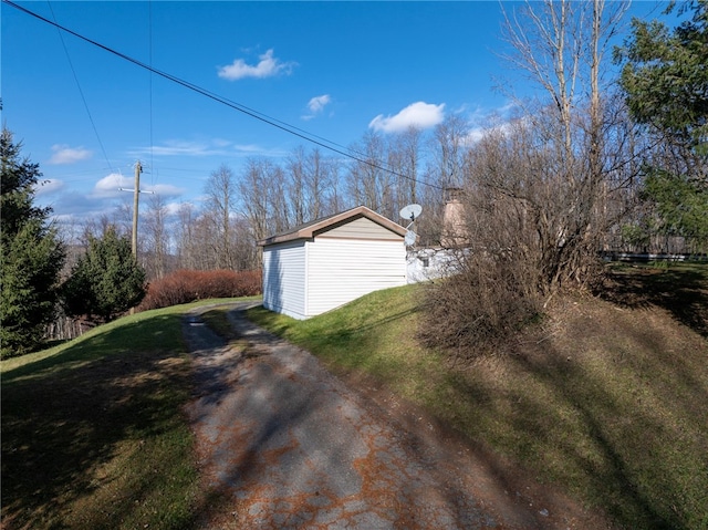 garage featuring a lawn