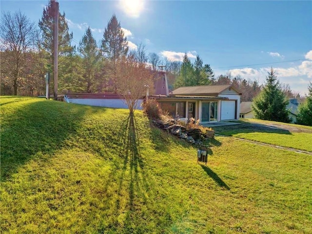 view of yard with a garage