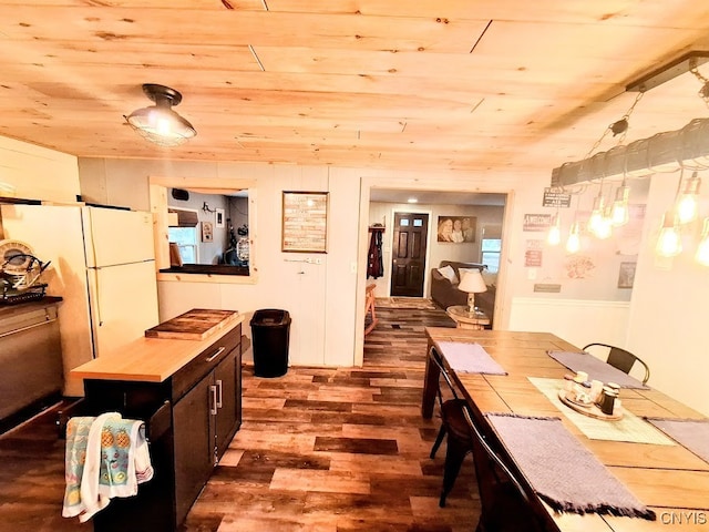 kitchen with dark hardwood / wood-style flooring, white refrigerator, decorative light fixtures, and wooden ceiling