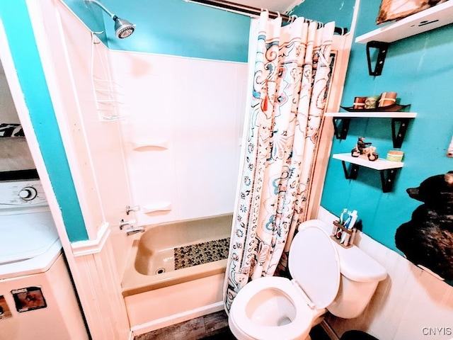 bathroom with shower / bath combo, toilet, and washer / clothes dryer