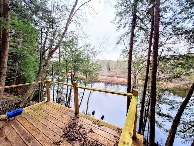 wooden deck with a water view