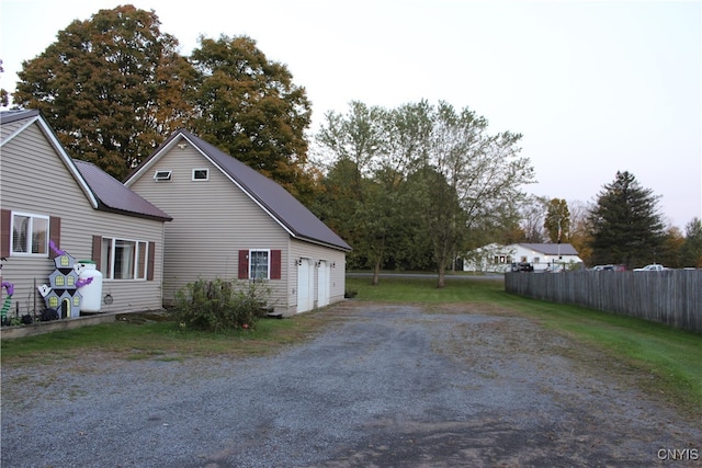 view of side of property with a garage