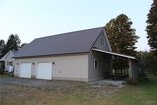 view of side of home with a garage