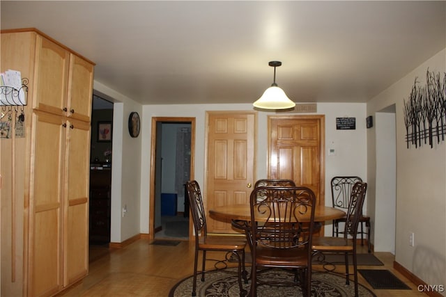 dining space with dark hardwood / wood-style floors