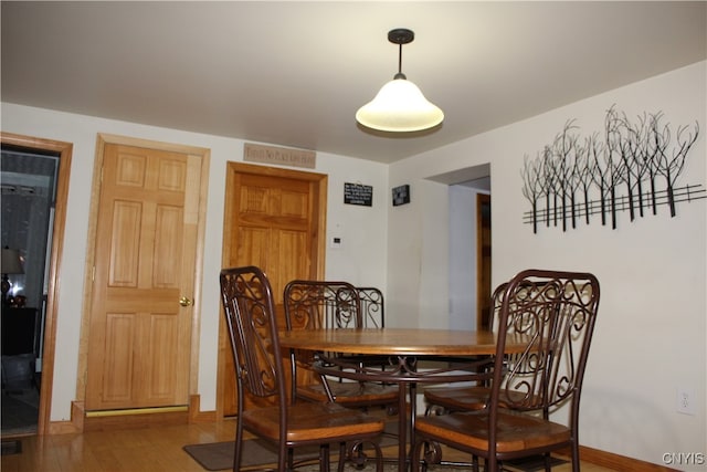 dining area featuring wood-type flooring