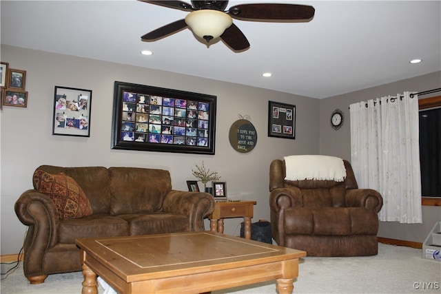 carpeted living room featuring ceiling fan