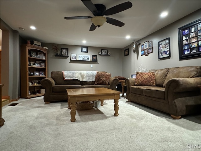 living room with carpet flooring and ceiling fan