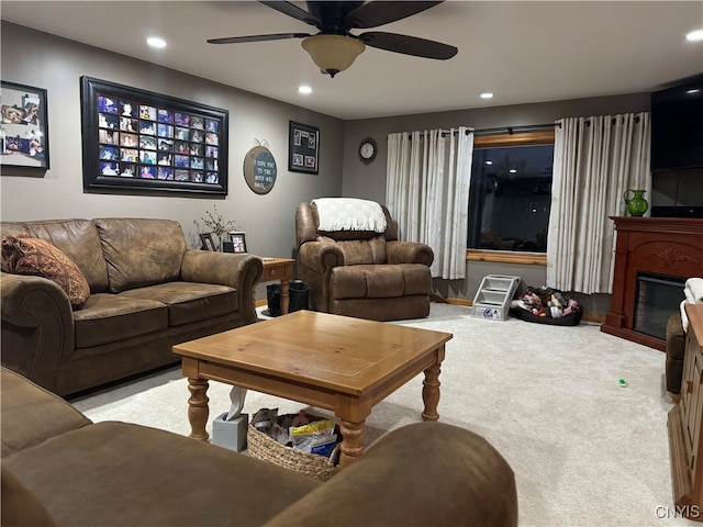 living room featuring ceiling fan and light colored carpet