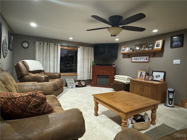 living room featuring carpet and ceiling fan