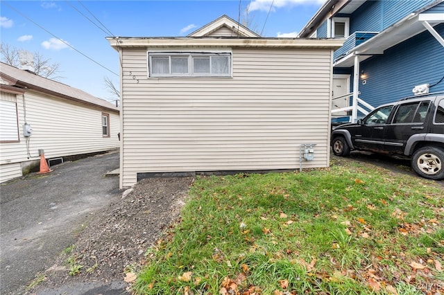 view of home's exterior featuring a yard