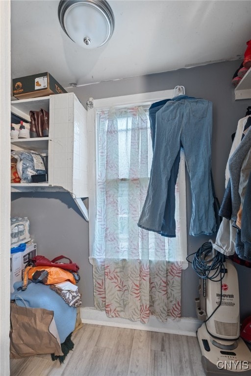 walk in closet featuring hardwood / wood-style flooring