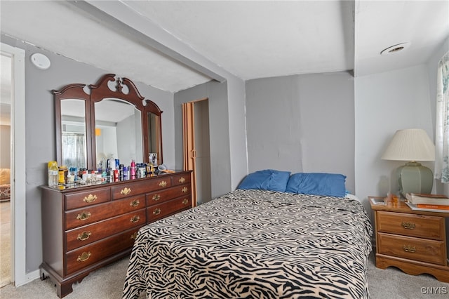 bedroom with light colored carpet