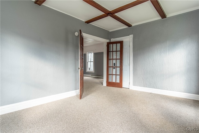 carpeted spare room featuring beam ceiling, coffered ceiling, and a baseboard heating unit