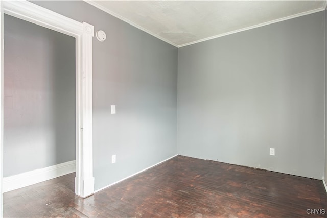 unfurnished room with dark hardwood / wood-style flooring and ornamental molding