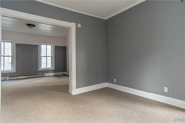 carpeted spare room with a baseboard radiator and ornamental molding