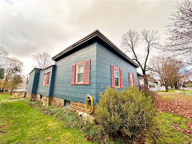 view of home's exterior featuring a yard