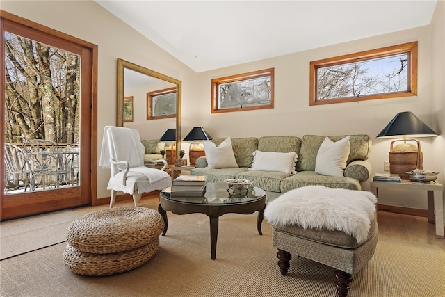 living room featuring lofted ceiling