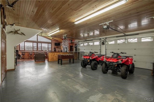 garage with wood ceiling and a garage door opener