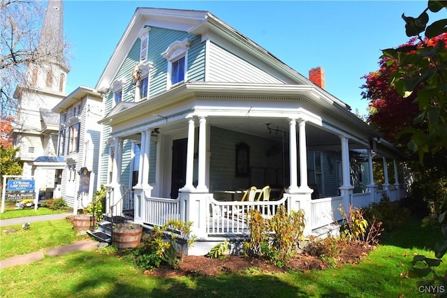 8 E Park, Kirkland, NY 13323 - view of side of home featuring a porch and a chimney