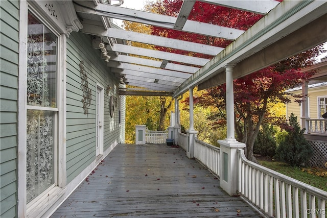 wooden terrace with a porch