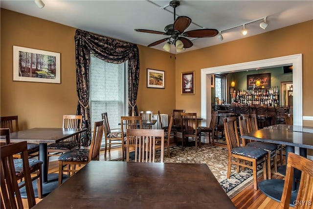 8 E Park, Kirkland, NY 13323 - dining room with rail lighting, a ceiling fan, wood finished floors, and bar area