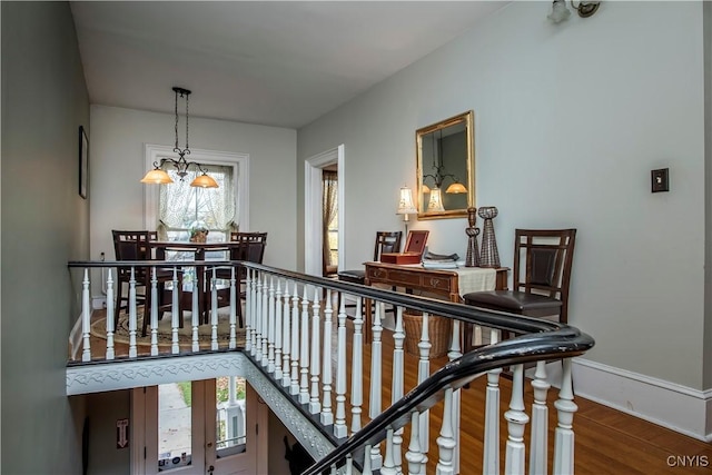 8 E Park, Kirkland, NY 13323 - hallway with plenty of natural light, wood finished floors, baseboards, and a chandelier