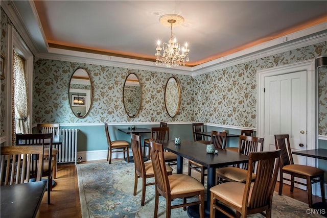 8 E Park, Kirkland, NY 13323 - dining room featuring a chandelier, wainscoting, ornamental molding, wood finished floors, and wallpapered walls