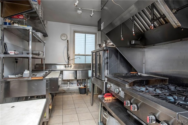 8 E Park, Kirkland, NY 13323 - kitchen featuring tile patterned flooring, wall chimney range hood, and track lighting