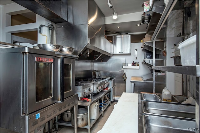 kitchen with stainless steel fridge and light tile patterned flooring