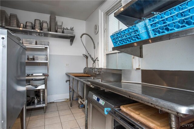 8 E Park, Kirkland, NY 13323 - kitchen featuring light tile patterned flooring and baseboards