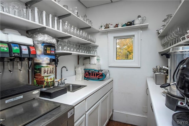 8 E Park, Kirkland, NY 13323 - kitchen featuring open shelves, a sink, baseboards, and light countertops