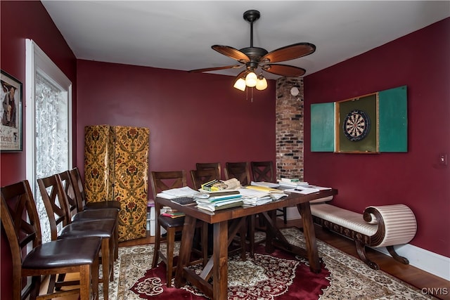 dining room featuring ceiling fan and wood-type flooring