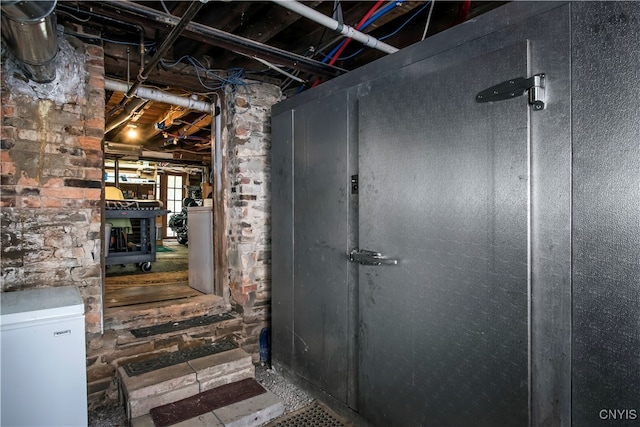 basement with fridge