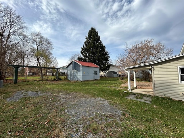 19 Jay St, Phelps, NY 14532 - view of green lawn featuring an outdoor structure