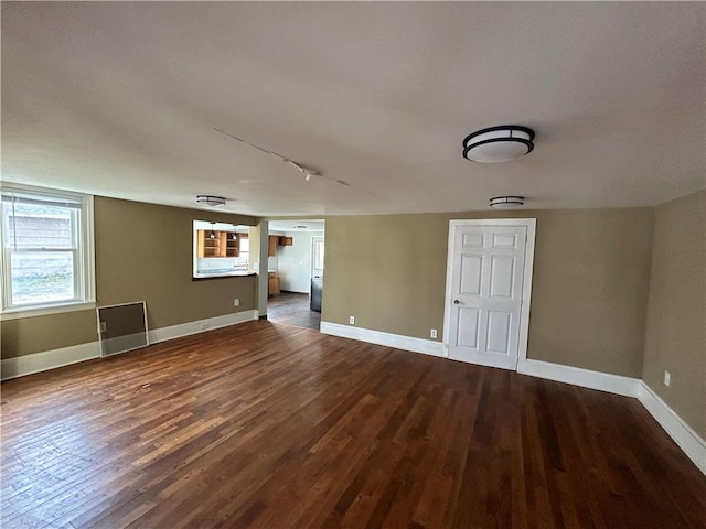 19 Jay St, Phelps, NY 14532 - empty room with dark wood-style floors and track lighting