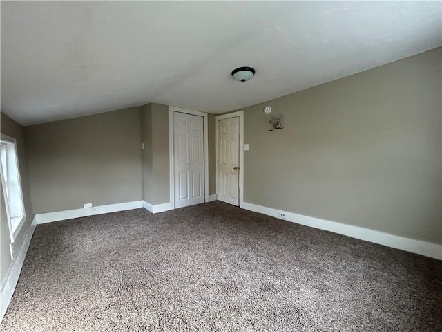 19 Jay St, Phelps, NY 14532 - carpeted spare room featuring baseboards and vaulted ceiling