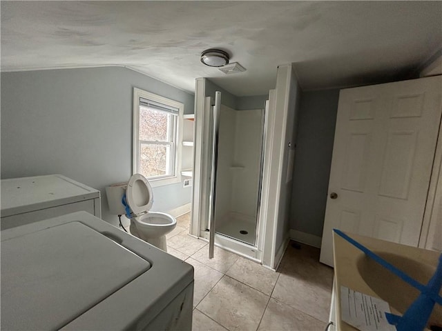 19 Jay St, Phelps, NY 14532 - bathroom with separate washer and dryer, vaulted ceiling, a stall shower, tile patterned flooring, and vanity