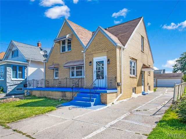 view of front of home with an outbuilding and a garage