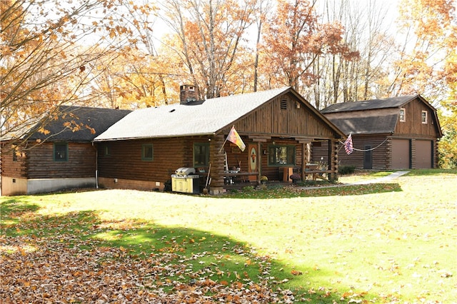 rear view of house featuring a porch and a yard