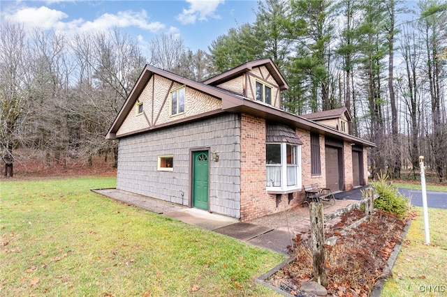 view of home's exterior featuring a lawn and a garage