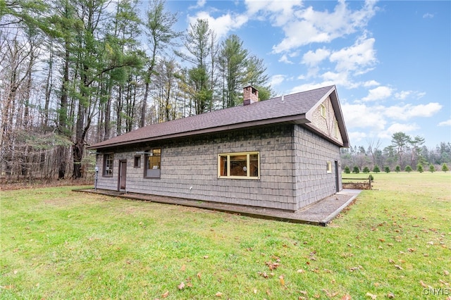 view of property exterior featuring a lawn